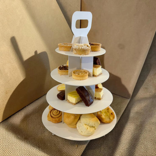 Donut Bouquet Canberra three-tier high tea stand filled with assorted gourmet tarts, cheesecakes, and pastries.