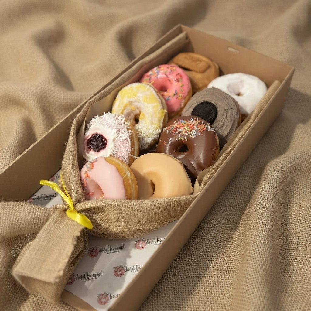 Donut Bouquet Canberra vegan donut bouquet featuring nine assorted XL donuts wrapped in hessian with a yellow ribbon